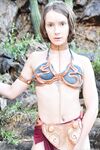 Skinny babe in Princess Leia costume Natalie rubs her clam outdoors