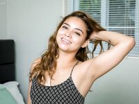 Young Latina girl Desiree Martinez removes dress and panties for first nudes