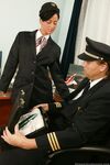 Hot flight attendant seduces and fucks a pilot while they await orders