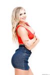 Hot blonde Alison Avery strikes great SFW poses in a denim miniskirt