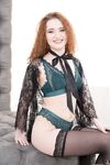 Sexy redhead Shelley Bliss posing in seductive undies and black stockings