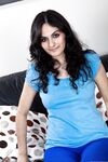 Brunette amateur Riani showcases her huge naturals and hairy muff