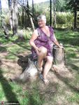 Fat granny Girdle Goddess loses her purple outfit in the woods and poses nude
