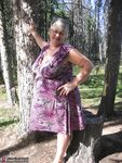 Fat granny Girdle Goddess loses her purple outfit in the woods and poses nude