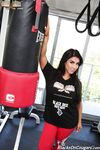 Sexy boxer cougar Raven Hart shows her big tits before an interracial rocking