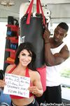 Sexy boxer cougar Raven Hart shows her big tits before an interracial rocking