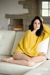 Beautiful brunette in panties Sade Mare flashes her tiny breasts on sofa