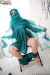 Clothed Indian Nadia Ali gets naked after finding a BBC poking thru gloryhole
