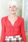 Over 70 Bristish granny takes off her clothes and lingerie striptease style