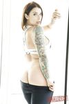 Tattooed hottie Ivy Lebelle shows her curvy body and stretches her butt