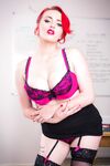 Stunning redhead teacher Jasmine James displaying her curvy body in class