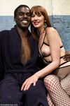 Skinny redhead dominatrix torments her black male sub with orgasm denial