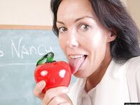 Naughty granny Nancy gets completely naked in the school room