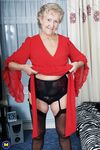 Old granny Ruth losing her red dress and exposing her saggy boobs in lingerie