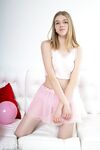 Young solo girl Junia makes her nude debut on a couch amid balloons