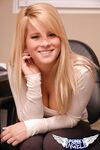 Young blonde girl reveals her bare ass cheeks in thong panties