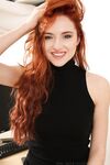 Model with red wavy hair Sophia Blake undresses & poses in sheer tights