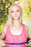 Young looking blonde Natasha showcases her pussy once she's totally naked