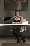 Inked MILF in glasses Bonnie Rotten uncovers her magnificent tits in a solo