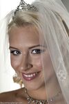 Blonde bride Katie Summers doffs her wedding dress & poses topless in lingerie