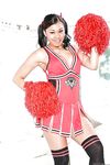 Ebony cheerleader babe poses gorgeously in her sexy red outfit
