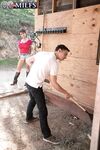 Hot granny Gina Milano seduces the ranchhand in cowgirl boots and jean shorts