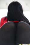 Dark haired teen pornstar Cyrstal Rae revealing nice tits in black pantyhose