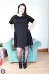 Brunette mom Eva Jayne removes her black dress and flaunts her curves