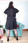 Brunette mom Eva Jayne removes her black dress and flaunts her curves