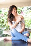 Brunette amateur Ana Greco slips off ripped jeans to get nude on a patio table