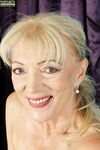 Naughty granny Janet Lesley revealing saggy tits before spreading cooter
