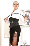Mature fetish lady in glasses taking off her skirt and exposing her butt