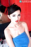 Brunette erotic model Sha Rizel displaying her firm big tits in the bath