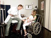 Wheelchair bound Megan Reece giving doctor footjob after cunnilingus