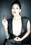 Tattooed sexy pornstar Asian showing big tits in sheer lingerie