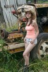 Redhead amateur Eva Green touts her fat ass in front of a box car in straw hat