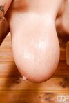 European milf with really big tits Laura Orsolya frolics in the sauna