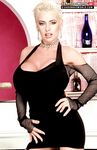 Sexy MILF SaRenna Lee exposes gigantic big tits & poses in black stockings