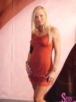 Sexy pornstar MILF Silvia Saint posing fully clothed in jeans and boots
