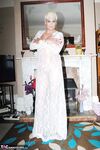 Older woman Dimonty pulls her tits out of long lace dress wearing no panties