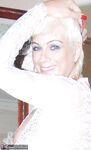 Older woman Dimonty pulls her tits out of long lace dress wearing no panties