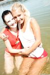 Cute Euro teens get naked at the beach and give lesbian sex a try