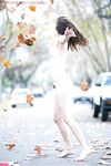 Adorable brunette babe Darya showing off her hairy cunt outdoors