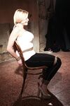 Tied and gagged female has her big tits and erect nipples exposed for her