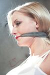 Tied and gagged female has her big tits and erect nipples exposed for her