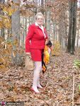 Horny granny Adonna removes her panties and toys herself in the woods