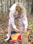 Horny granny Adonna removes her panties and toys herself in the woods