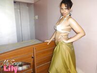 Indian woman lets a boob slip loose from her bra while being a tease