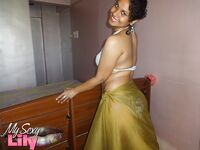 Indian woman lets a boob slip loose from her bra while being a tease