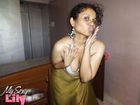 Indian woman lets a boob slip loose from her bra while being a tease